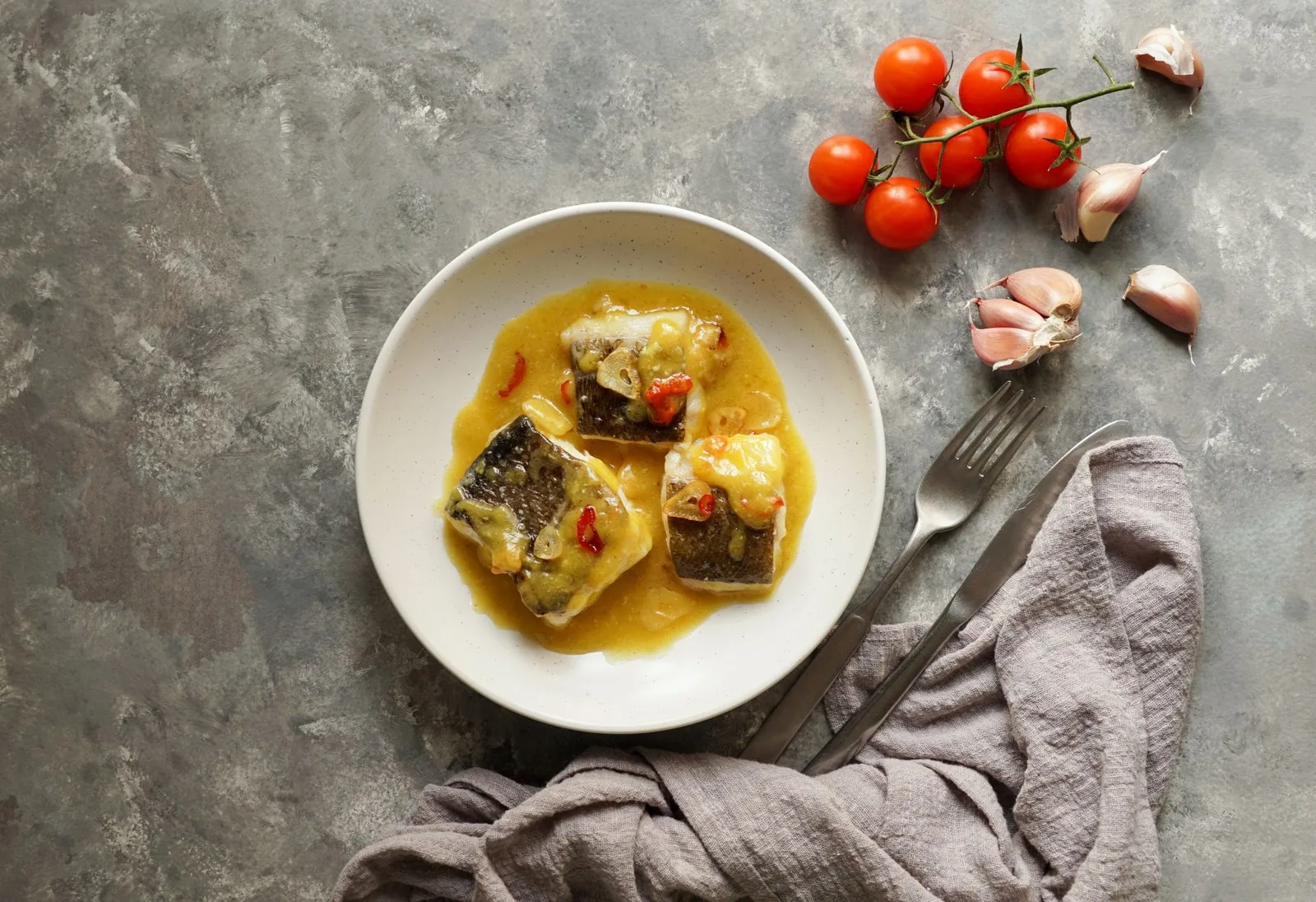bacalao al pil pil, salted cod in emulsified olive oil sauce, spanish cuisine, basque country
